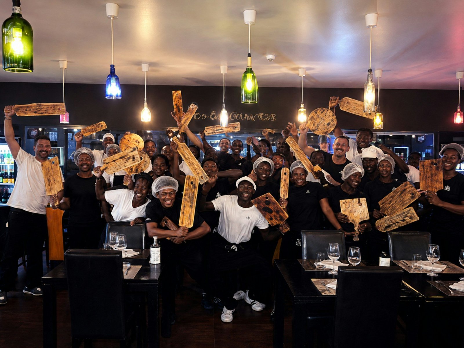 Hospitality team celebrating in a restaurant