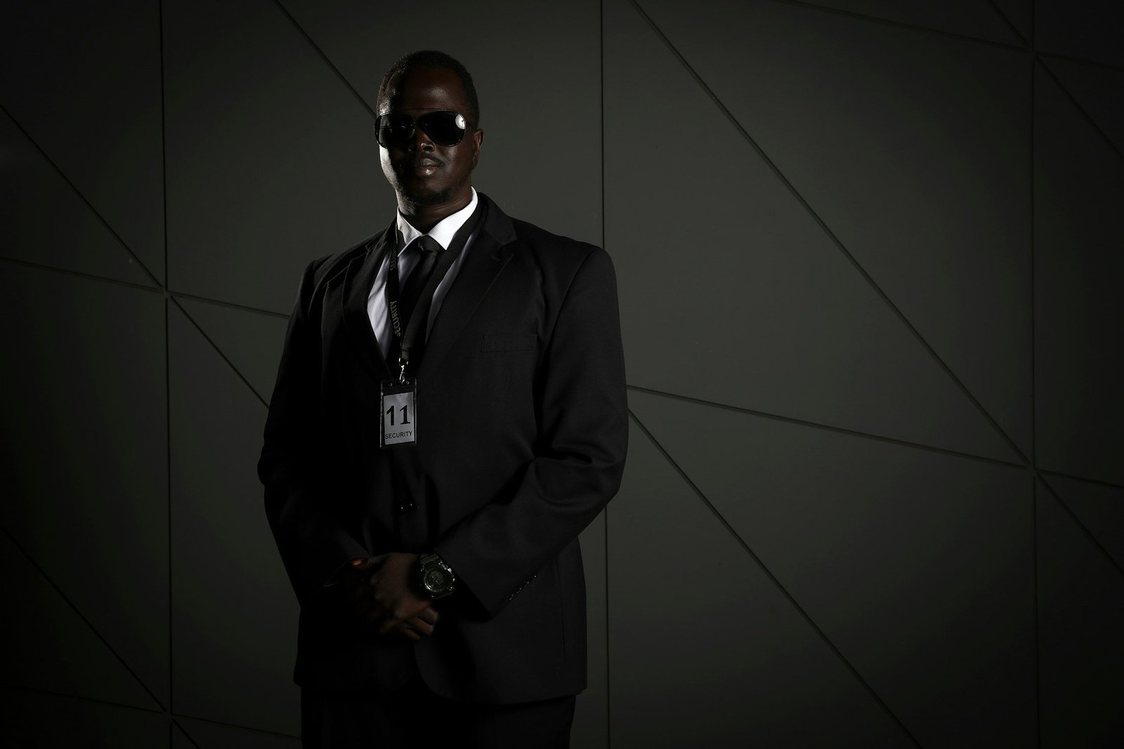 Operations officer in a dark suit with an ID badge