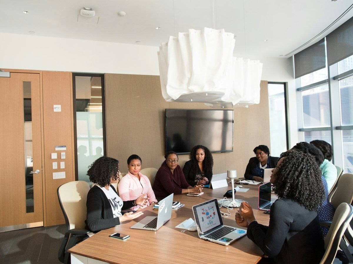 Colleagues around a meeting table