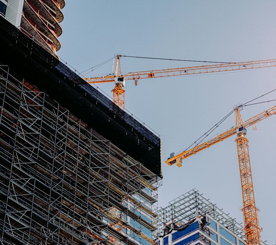 Tower cranes above a building under construction